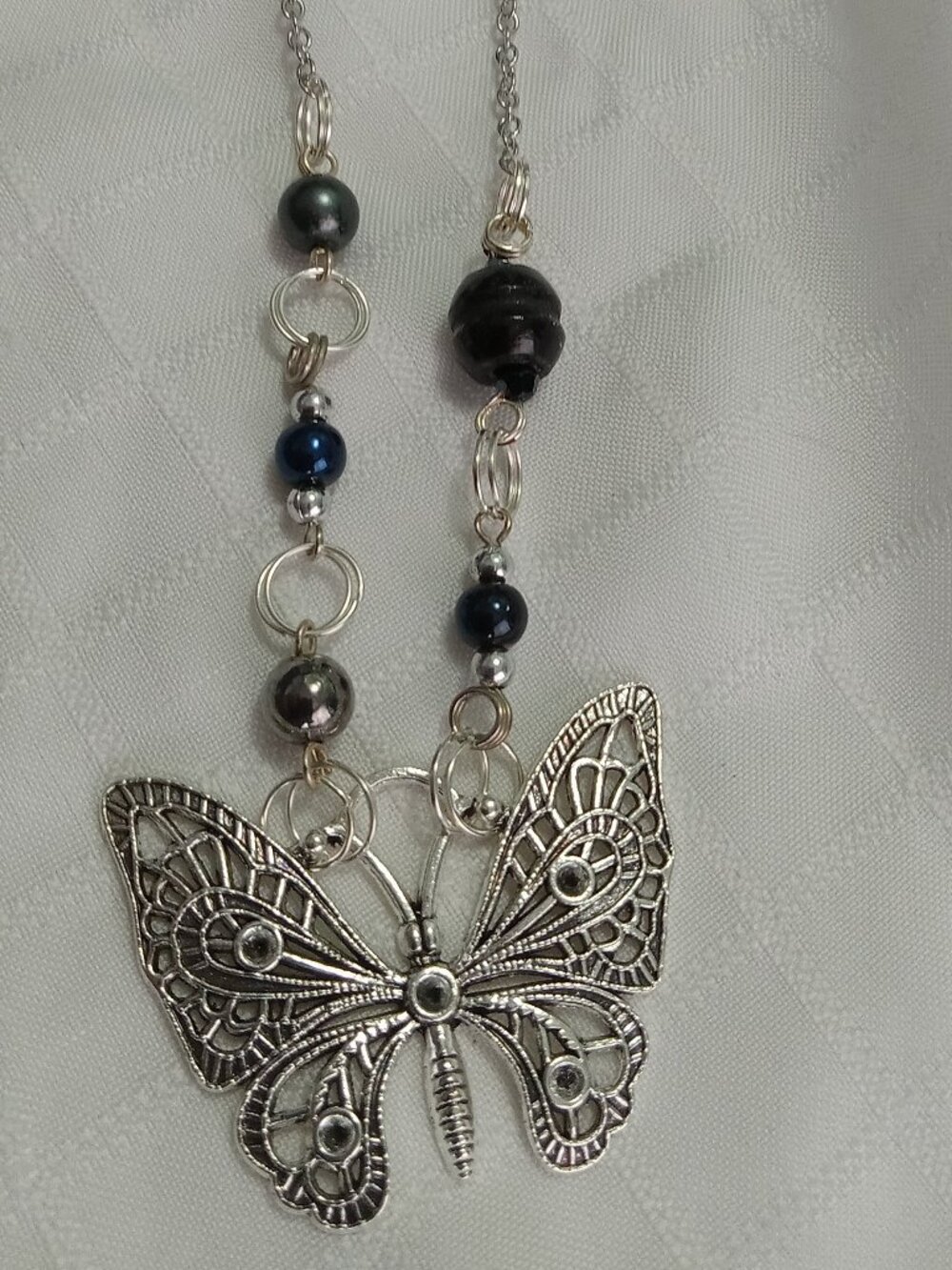 A pretty, minimalist, asymmetrical, reversible handmade necklace